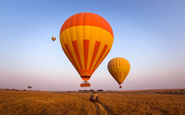 Balloon safari Hot air balloons over the masai mara, Kenya off road vehicle photos stock pictures, royalty-free photos & images