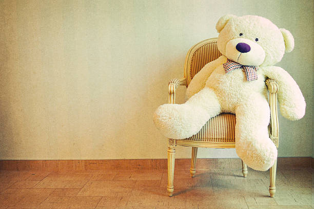istock Teddy sitting on vintage armchair 598531350