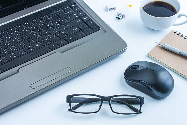 istock office table with glasses and coffee,computer, business concept, 598531672