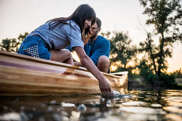 Couple enjoying a boat ride on the lake.