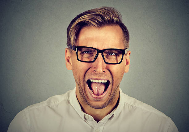 istock portrait of young angry man 598533954