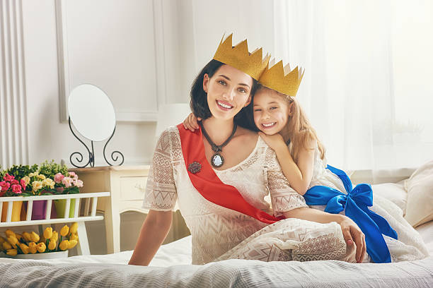istock queen and princess in gold crowns 598535718