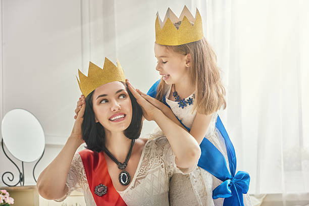 istock queen and princess in gold crowns 598535872