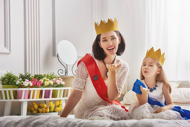 istock queen and princess in gold crowns 598536002