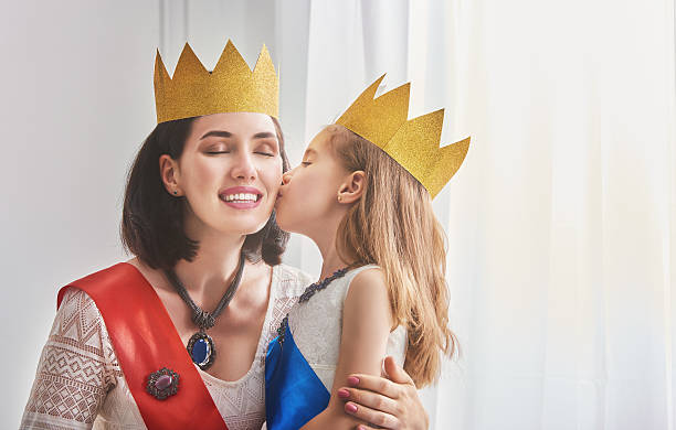 istock queen and princess in gold crowns 598536600