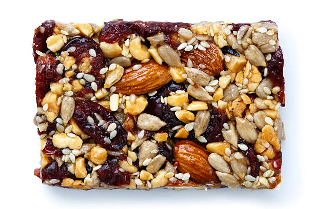 istock Fruit, nut and seed bar with cranberries isolated on white. 598537456