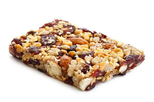 istock Fruit, nut and seed bar with cranberries isolated on white. 598537644