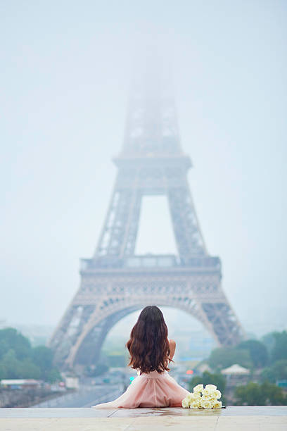 istock Parisian woman in front of the Eiffel tower 598538798