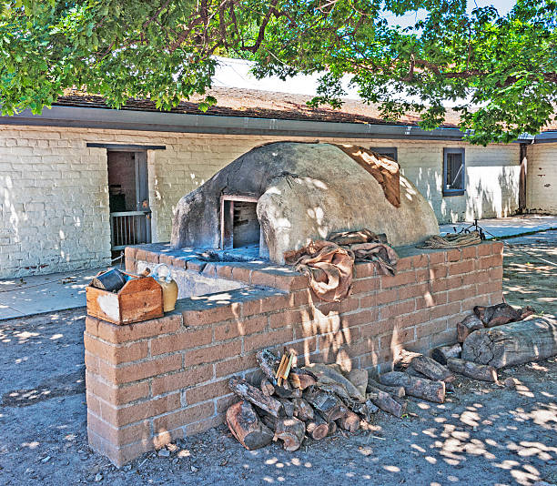 Bee Hive Historic Oven Sutters Fort State Park This historic behive oven is an example of what was used for baking in the era before electricity and in the pioneer days of California. adobe oven stock pictures, royalty-free photos & images