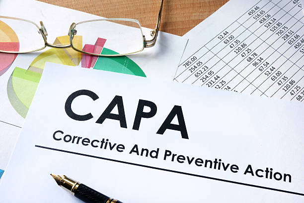 istock Paper with words CAPA Corrective and Preventive action plans 598540536