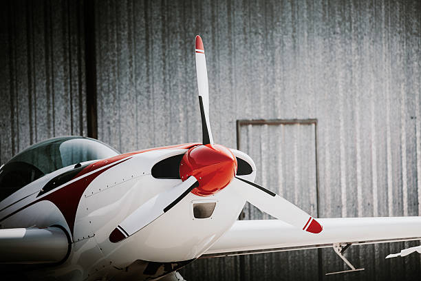 Business small plane. Close up of white and red small aircraft out of the hangar. military private stock pictures, royalty-free photos & images