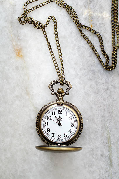 istock Pocket watch with  chain on marble. 598540944