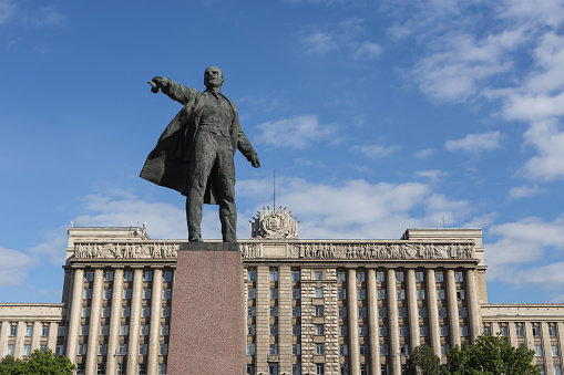 Monument to Lenin on the background of the House of Soviets at Moscow Square in summer sunny evening