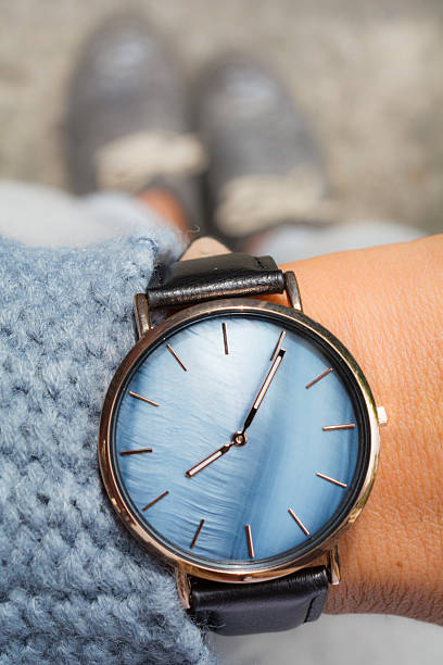 istock Personal perspective woman looking at her blue watch 598542484