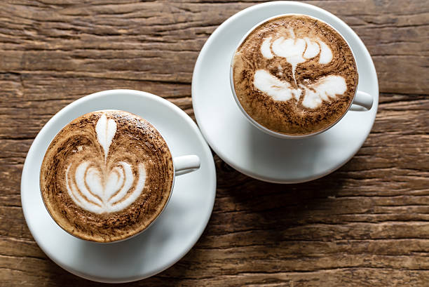 istock Two Hot cappuccino in white cup and plate 598542946