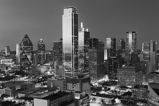 Dallas City Skyline at dusk, sunset. Dallas Texas downtown, business center. Commercial zone in big city. Dallas City view from Reunion Tower. Black and white tone.