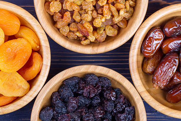 istock Dried fruits assortment on wooden background. Top view 598544980