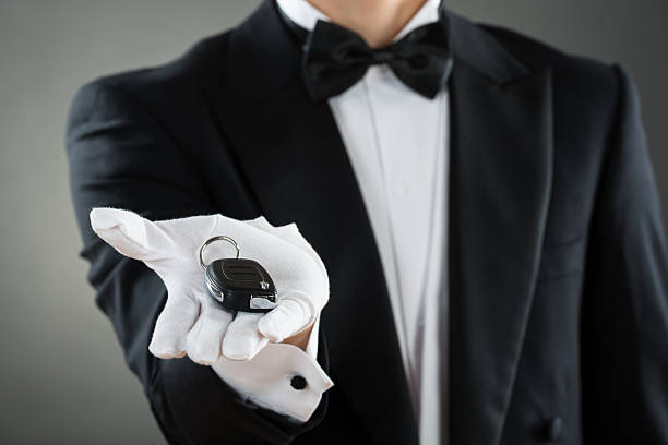 istock Midsection Of Waiter Holding Car Key 598545246