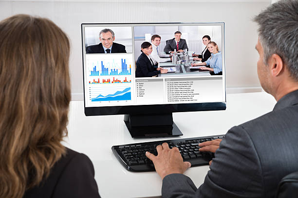 istock Two Businesspeople Participating In Video Conference 598547576