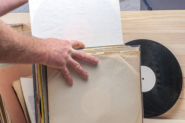 istock Browsing through vinyl records collection. Music background. Copy space 598549648