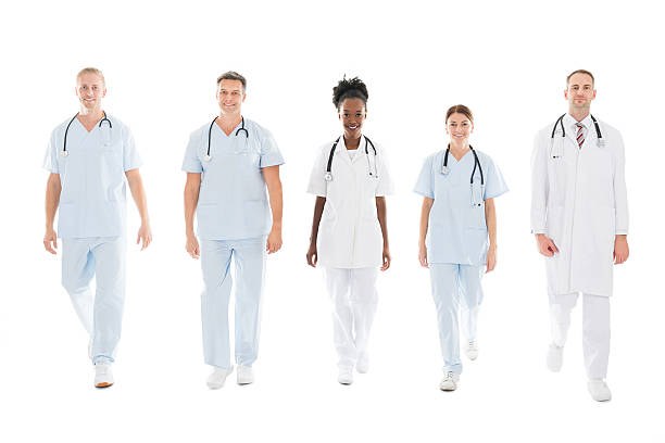 istock Confident Multiethnic Medical Team Walking In Row 598549936