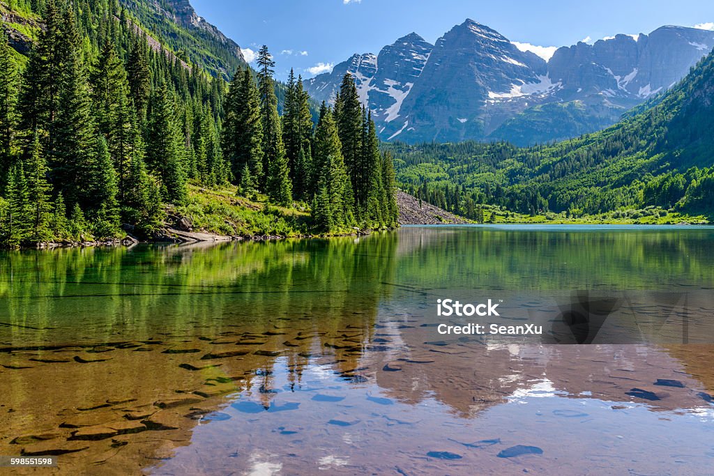 Maroon Lake A Spring evening at colorful Maroon Lake, with Maroon Bells rising in the background, Aspen, Colorado, USA. Colorado Stock Photo