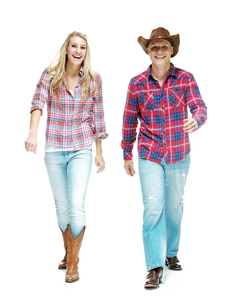 istock Smiling cowboy couple walking 598551904