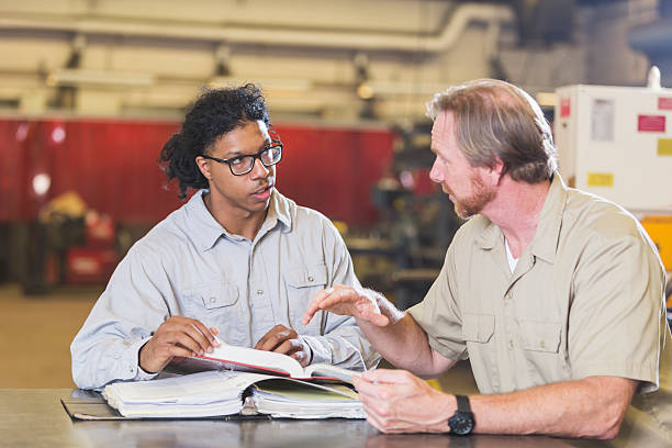 istock Young man with instructor in vocational school 598556022