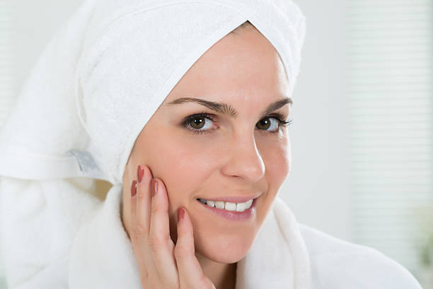 istock Woman With Towel Wrapped On Head 598558554