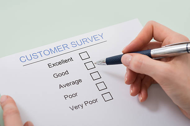 istock Woman Filling Customer Satisfaction Form 598559628