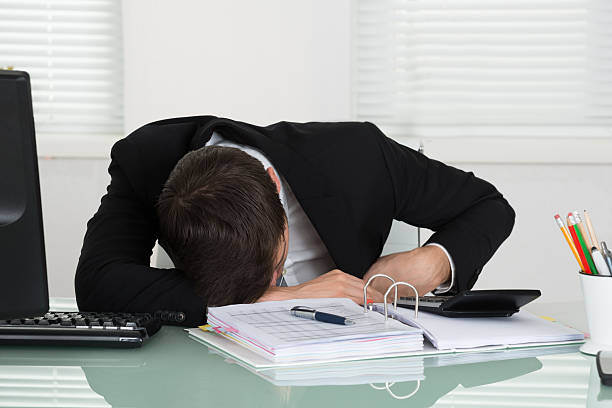 istock Businessman Sleeping With Invoice On Desk 598559970
