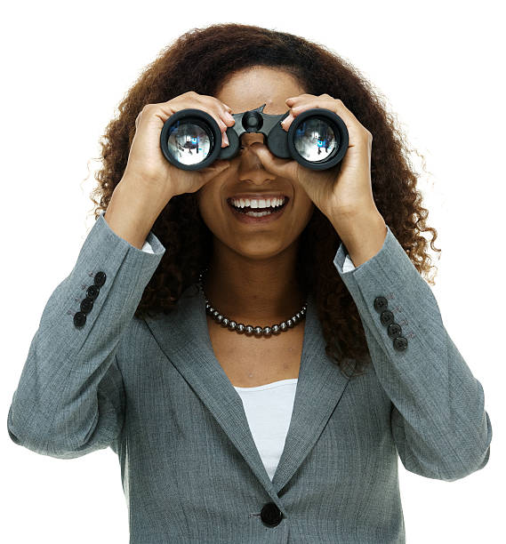 istock Cheerful businesswoman searching with binocular 598560196