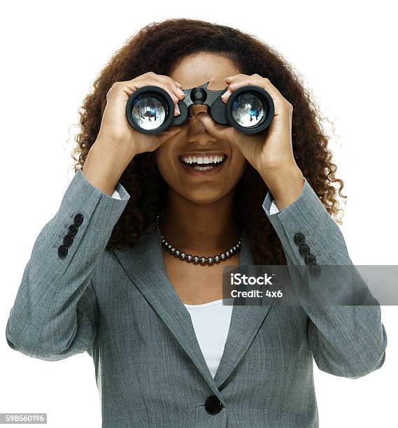 Cheerful Businesswoman Searching With Binocular Stock Photo - Download Image Now - The Way Forward, Binoculars, African Ethnicity