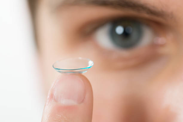 Man Holding Contact Lens On Finger