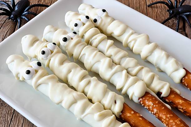 istock Halloween mummy candy dipped pretzel rods, on plate 598560596