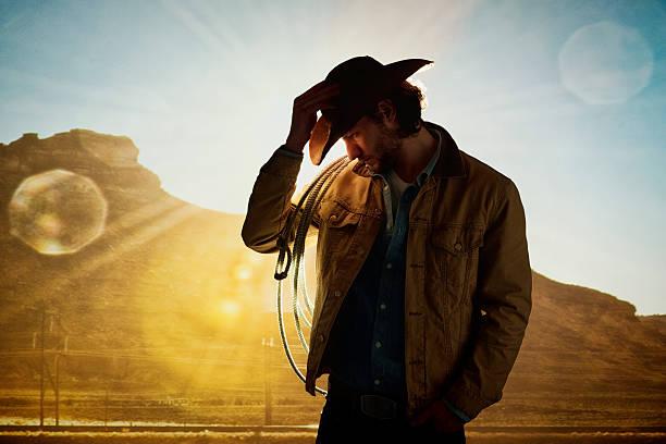 istock Cowgirl standing at the mountain 598561508