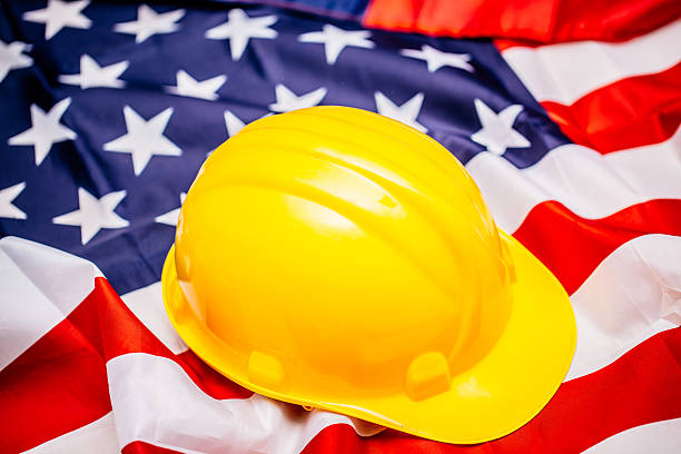 istock American flag and working helmet 598561726
