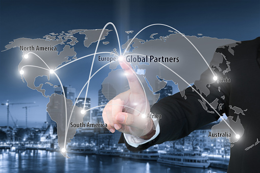 Businessman working with virtual interface connection map of global partner connection use for logistic,import,export background.(Elements of this image furnished by NASA)