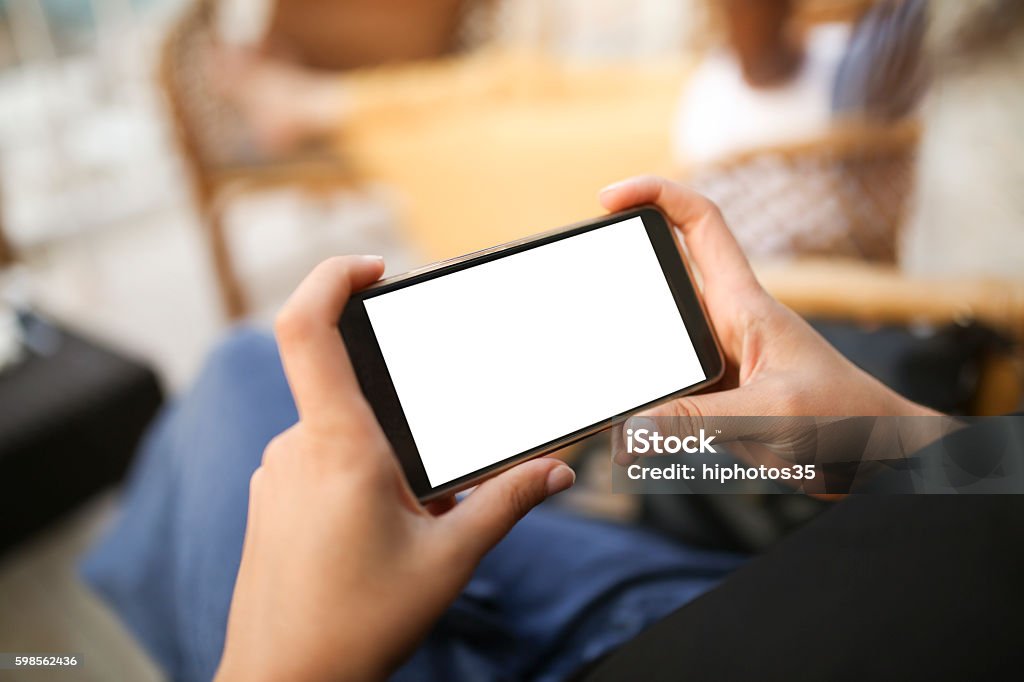 Person using mobile smartphone Peron using mobile smartphone. Shot with third person view. Horizontal Stock Photo