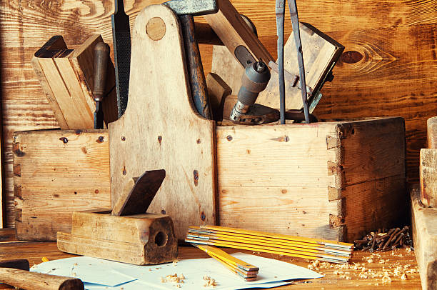 istock Equipment carpenter on a wooden desk with plans 598562498