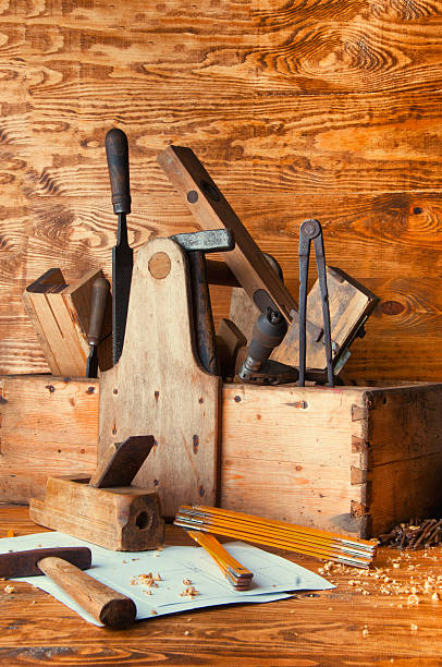 istock Equipment carpenter on a wooden desk with plans 598563556
