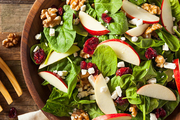 homemade autumn apple walnut spinach salad - vegetarian salad imagens e fotografias de stock