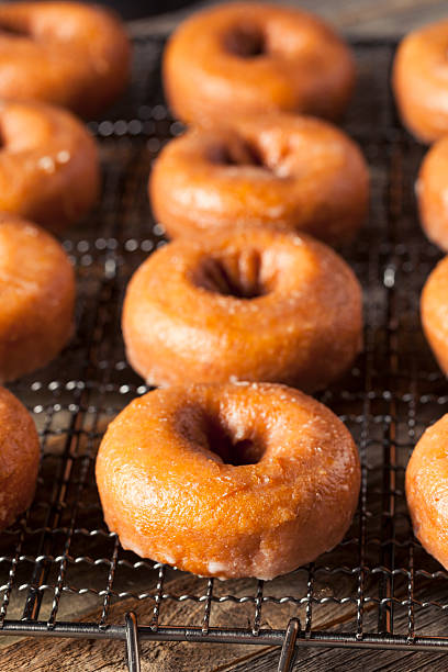 istock Homemade Glazed Autumn Pumpkin Donuts 598568072