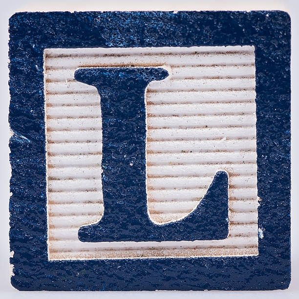 istock Letter L old wooden painted block 598570224