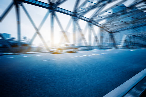 istock City road with moving traffic 598571718