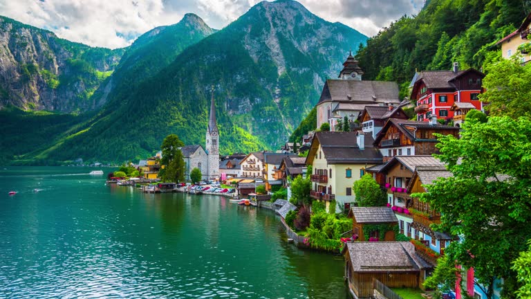 Scenic picture-postcard view of famous Hallstatt mountain village with Hallstaetter Lake in the Austrian Alps, region of Salzkammergut, Austria