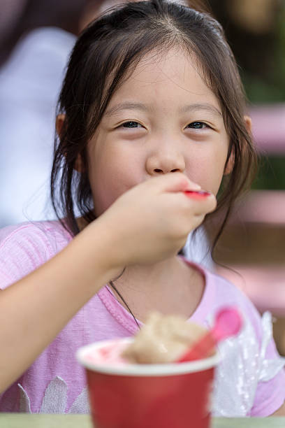 istock Happy Kid Eating Ice Cream 598665972