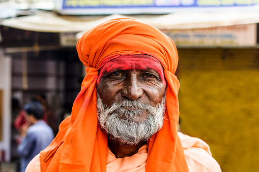 Pushkar, Rajasthan, India - May 29, 2016: Portrait of an unidentified Sadhu (holy man), on a pilgrimage to the holy lake Pushak Sarovar in the town of Pushkar in Ajmer district of the Rajasthan state of western India.