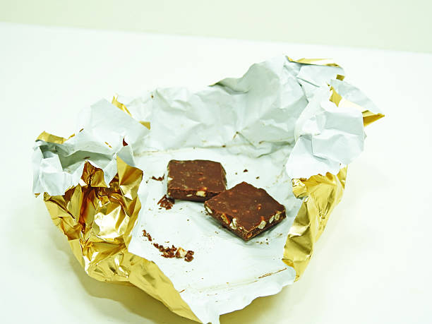 istock Chocolate bar in golden foil. 598666402