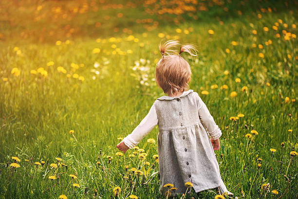 istock learns to walk the sunny summer 598667344